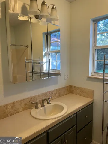 a bathroom with a shower and a bath tub