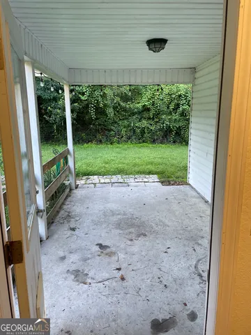 a view of a yard with a tree