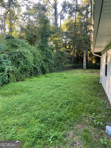 a view of a backyard with a garden