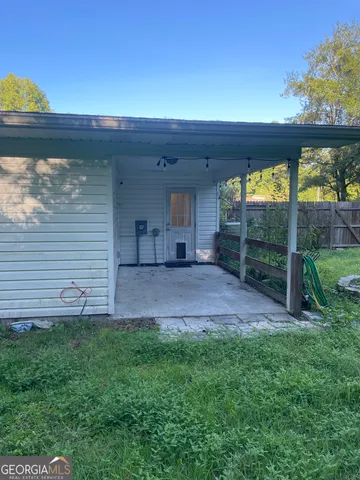 a view of a backyard with large trees