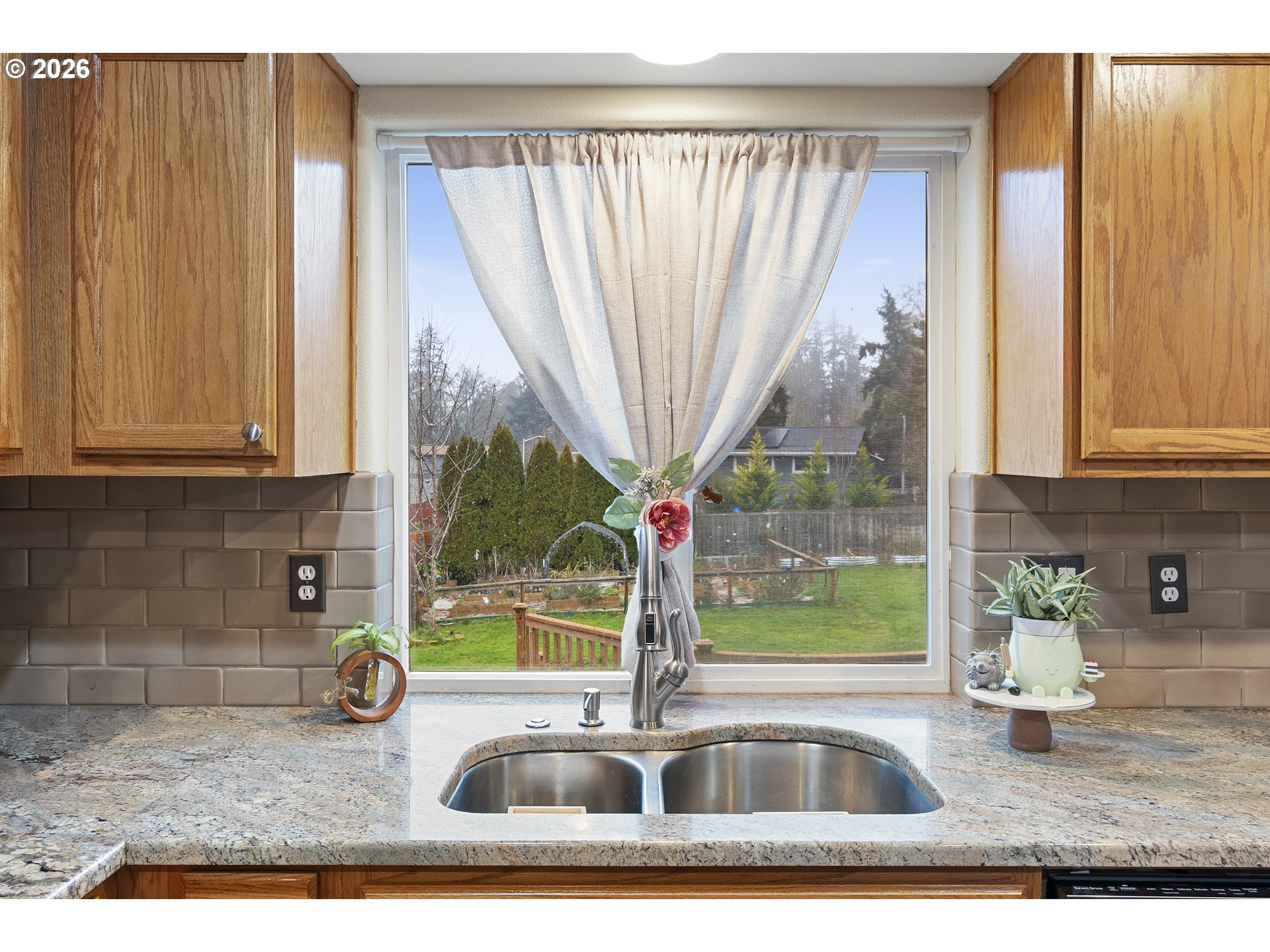 13177 Moccasin Way Oregon City, OR 97045 - Photo 12 of 44 a kitchen with a sink a counter top space and cabinets