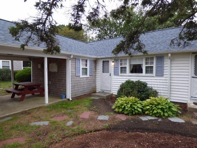 75 Beaten Road, Unit 9 Dennis Port, MA 02639 - Photo 1 of 14 a front view of a house with garden