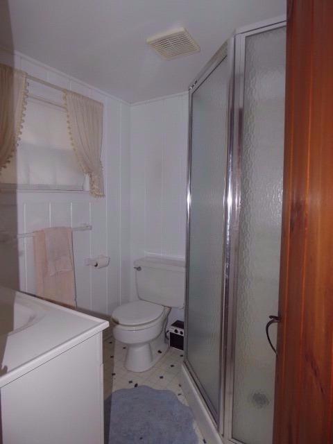 75 Beaten Road, Unit 9 Dennis Port, MA 02639 - Photo 12 of 14 a bathroom with a granite countertop sink toilet and shower