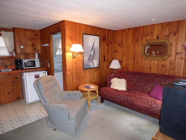 75 Beaten Road, Unit 9 Dennis Port, MA 02639 - Photo 4 of 14 a living room with furniture and a painting