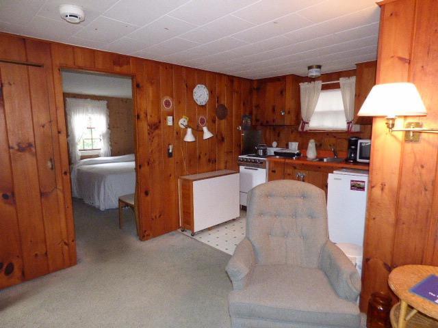 75 Beaten Road, Unit 9 Dennis Port, MA 02639 - Photo 5 of 14 a living room with furniture and a lamp