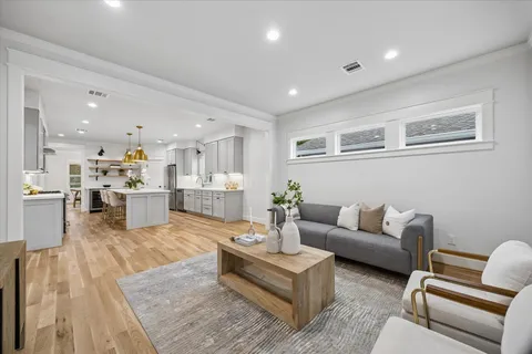 a living room with furniture and windows