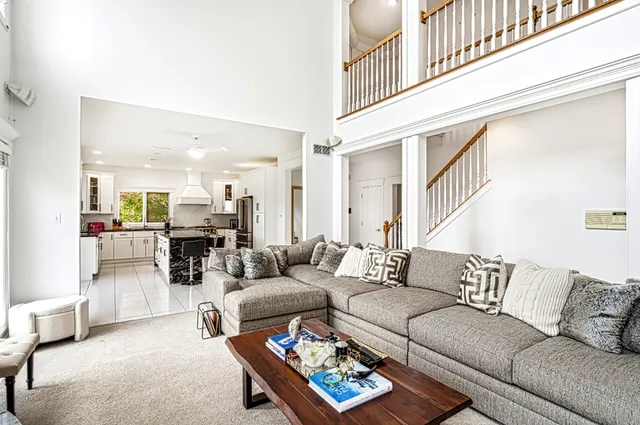 a living room with furniture or couch and a dining table