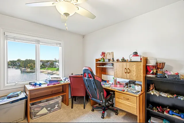 a room with furniture toys and a large window