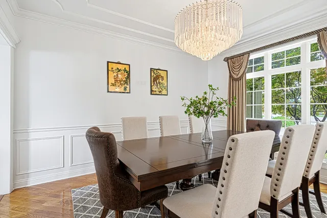 a view of a dining room with furniture and window