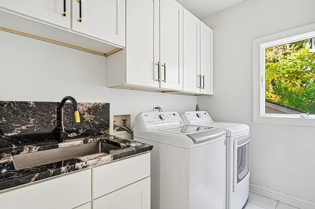 a view of washer and dryer with kitchen appliances