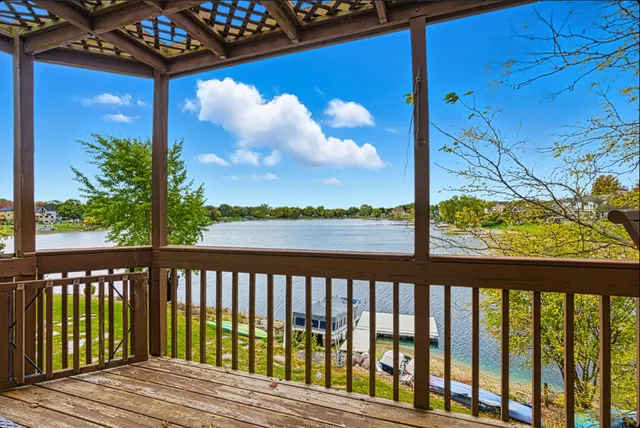 a view of a wooden balcony with a pot