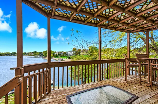 a view of a porch with wooden floor