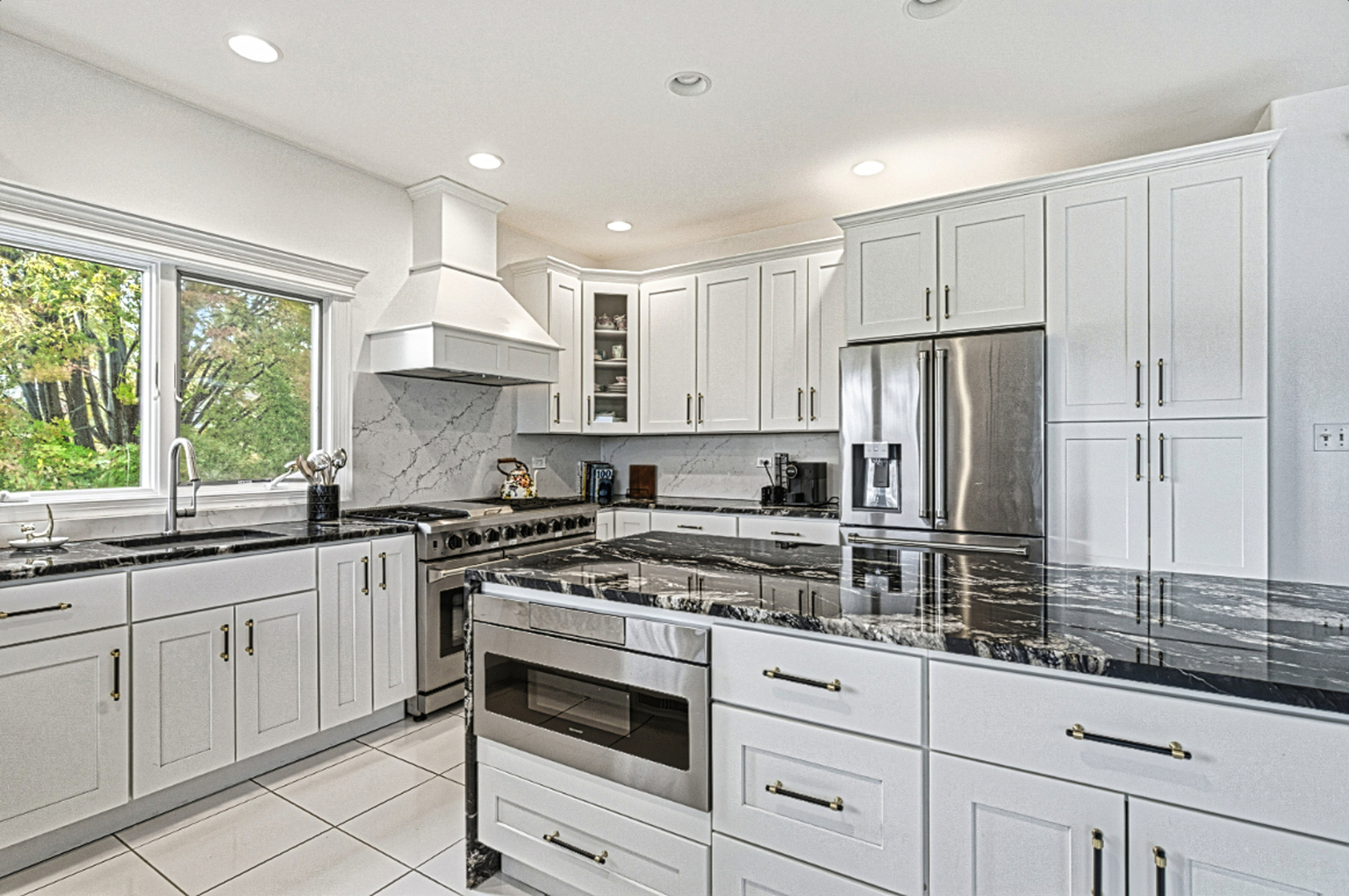 220 Santos Avenue Minooka, IL 60447 - Photo 7 of 46 a kitchen with white cabinets and appliances
