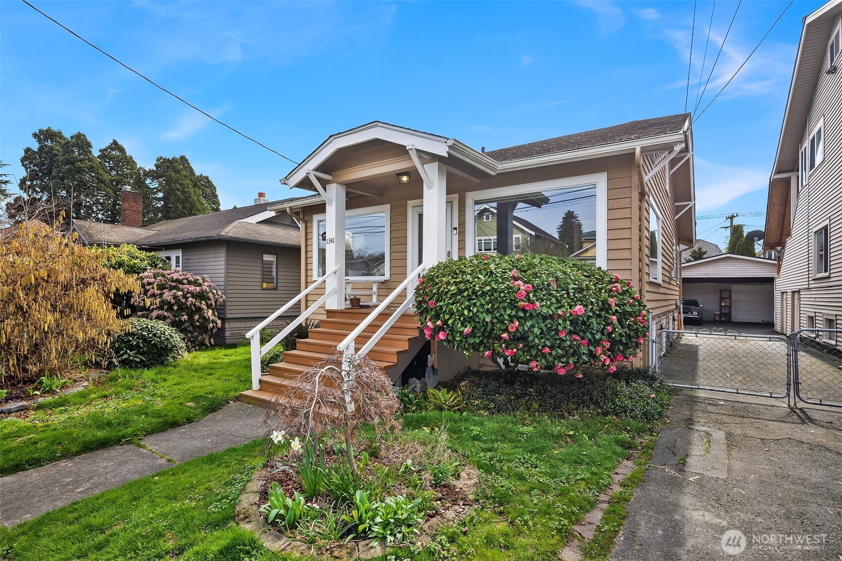 1341 North 78th Street Seattle, WA 98103 - Photo 1 of 23 a front view of a house with a garden