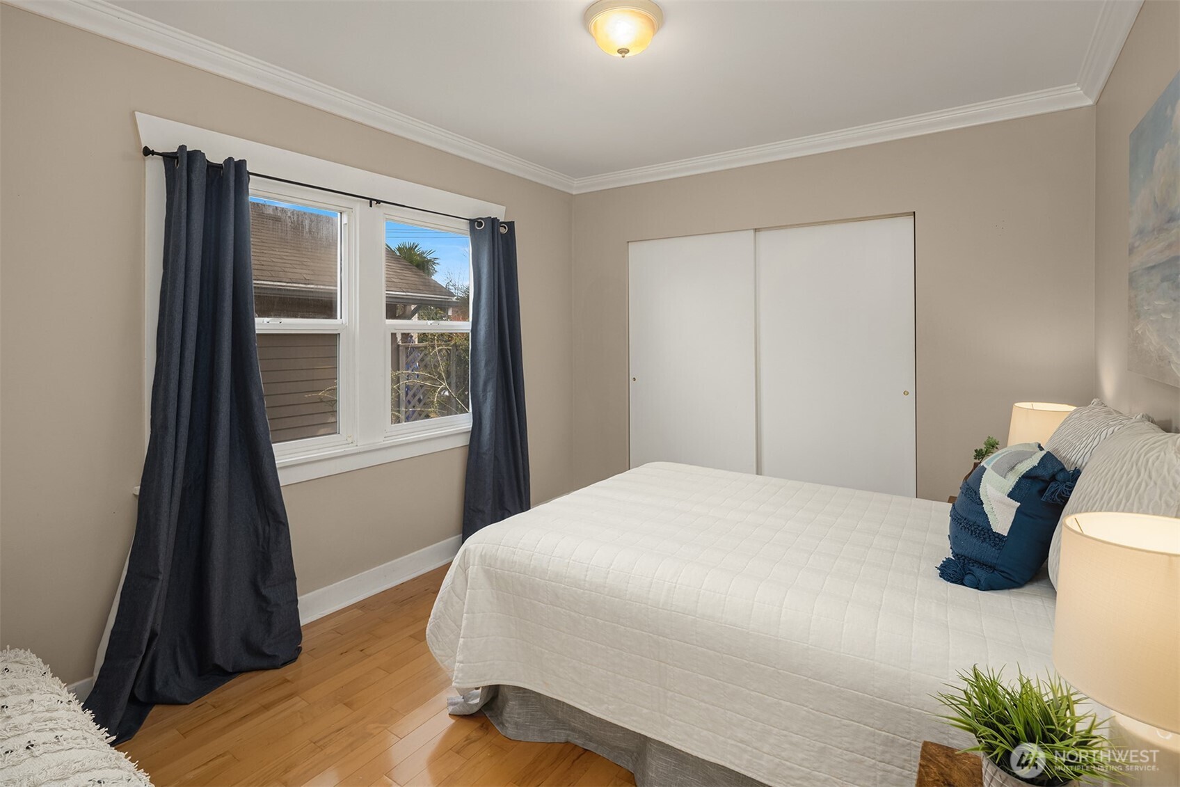 1341 North 78th Street Seattle, WA 98103 - Photo 12 of 23 a bedroom with a bed and a window