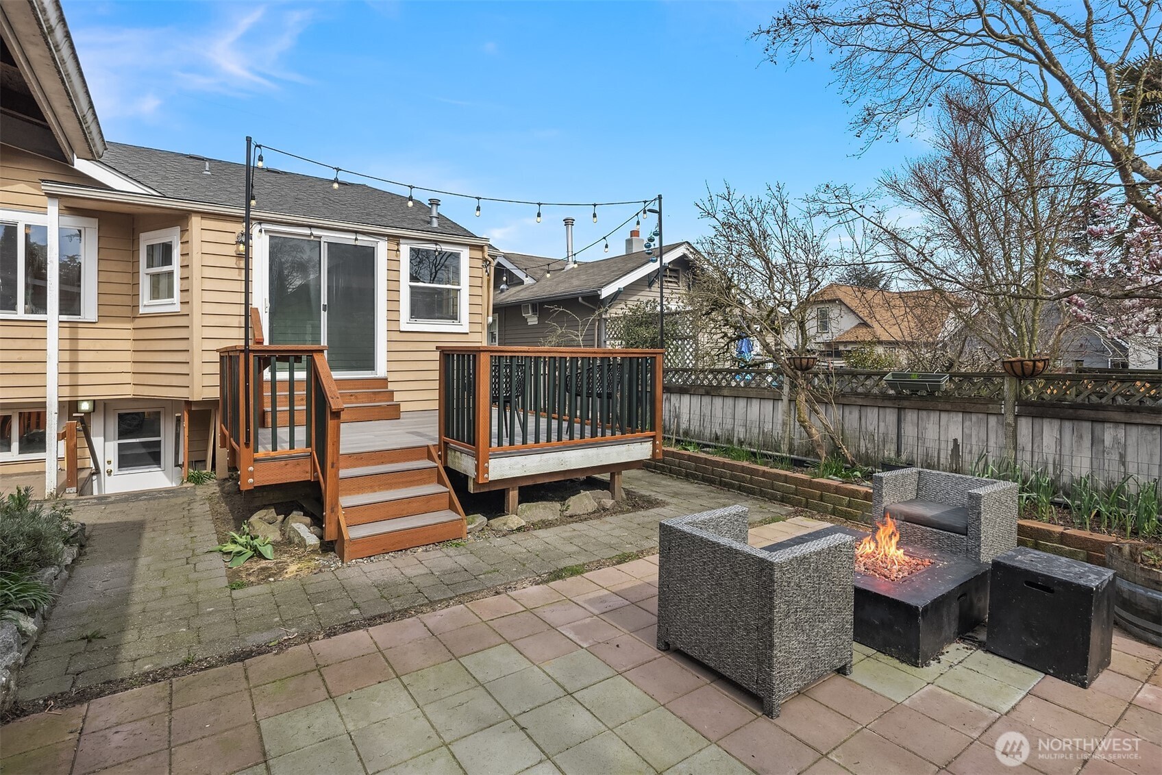 1341 North 78th Street Seattle, WA 98103 - Photo 14 of 23 a view of a deck with furniture and a yard