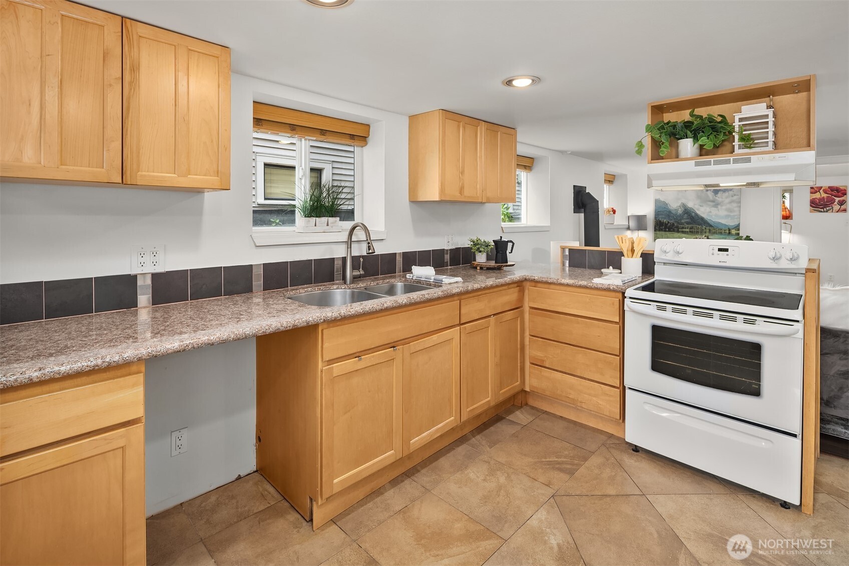 1341 North 78th Street Seattle, WA 98103 - Photo 16 of 23 a kitchen with a sink stove and cabinets
