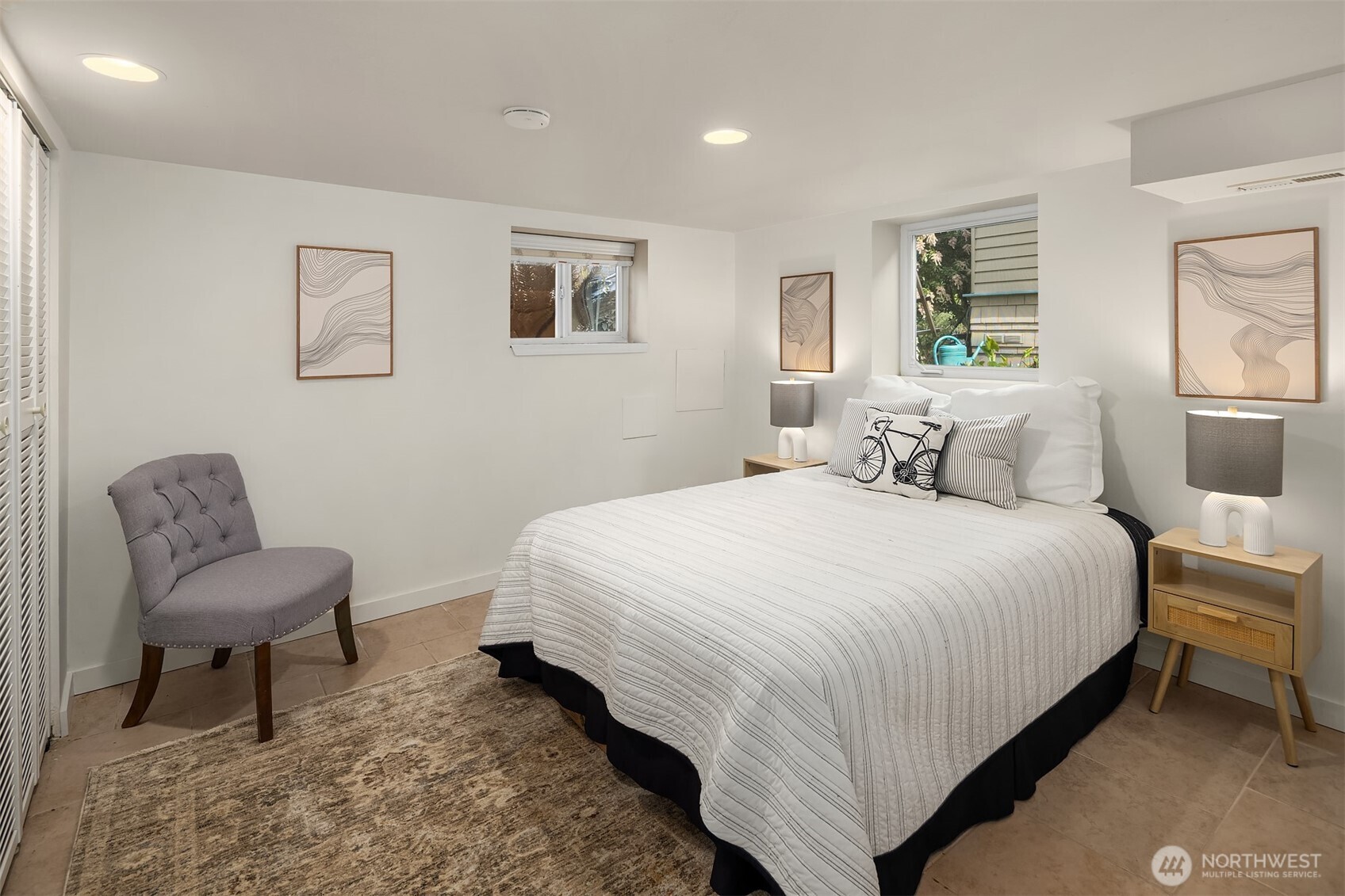 1341 North 78th Street Seattle, WA 98103 - Photo 21 of 23 a bedroom with a bed and a chair