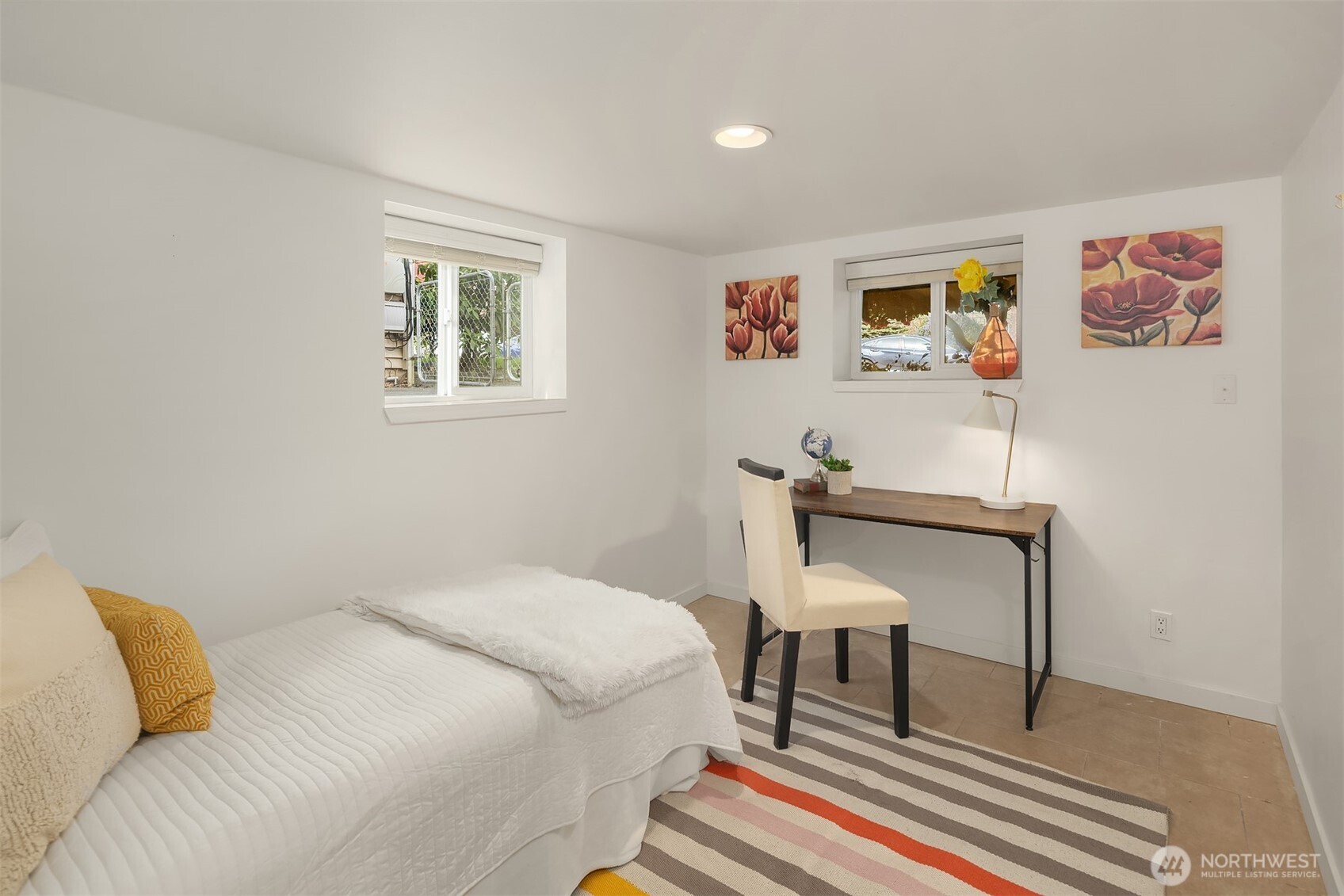 1341 North 78th Street Seattle, WA 98103 - Photo 22 of 23 a bedroom with a bed and a table