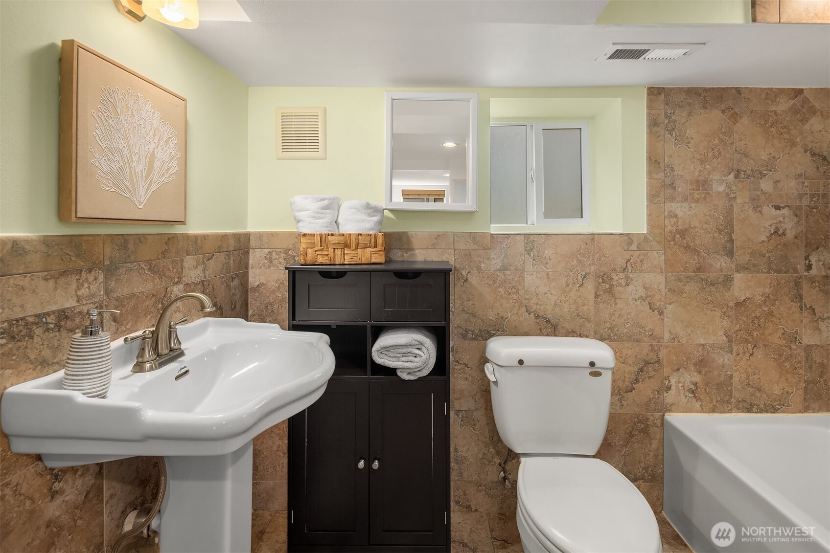 1341 North 78th Street Seattle, WA 98103 - Photo 23 of 23 a bathroom with a toilet sink and mirror