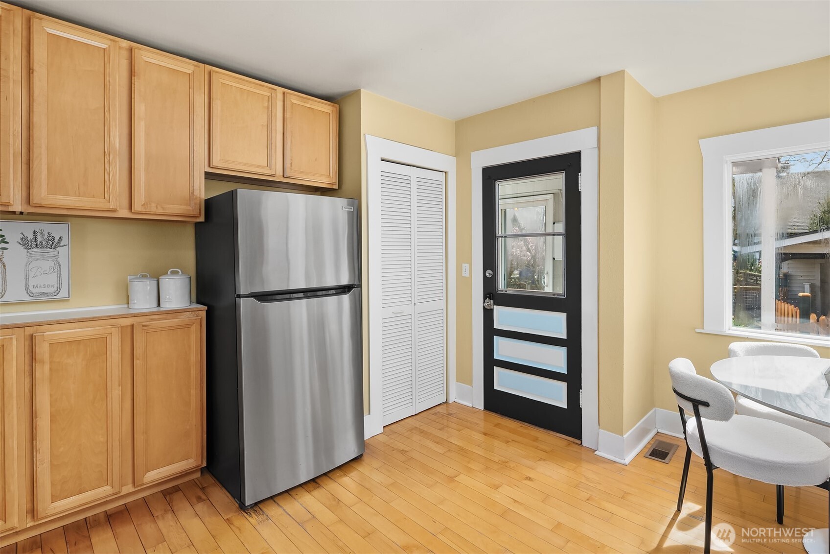 1341 North 78th Street Seattle, WA 98103 - Photo 8 of 23 a kitchen with stainless steel appliances granite countertop a refrigerator and a stove top oven
