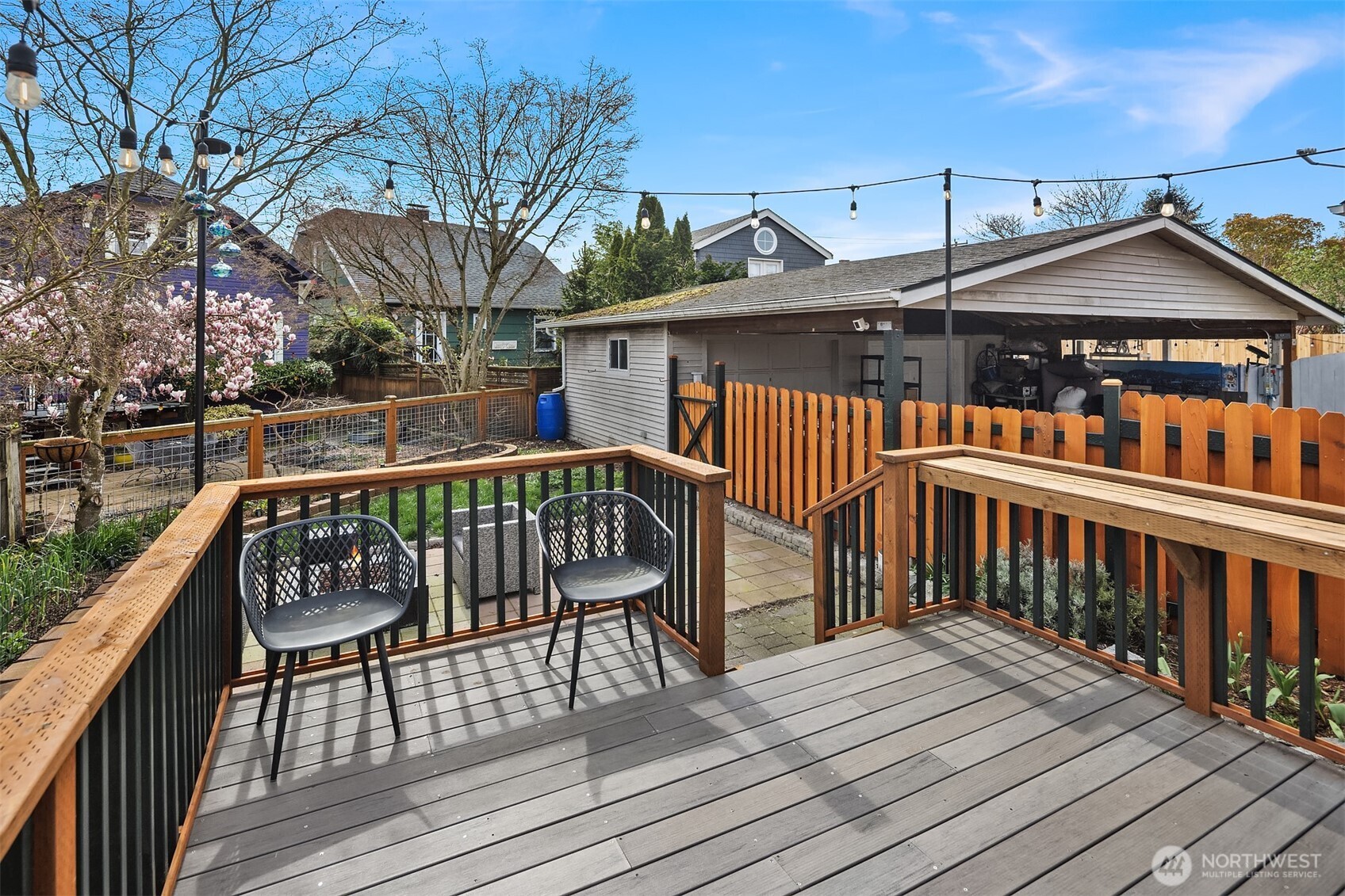 1341 North 78th Street Seattle, WA 98103 - Photo 9 of 23 a view of a wooden deck with furniture