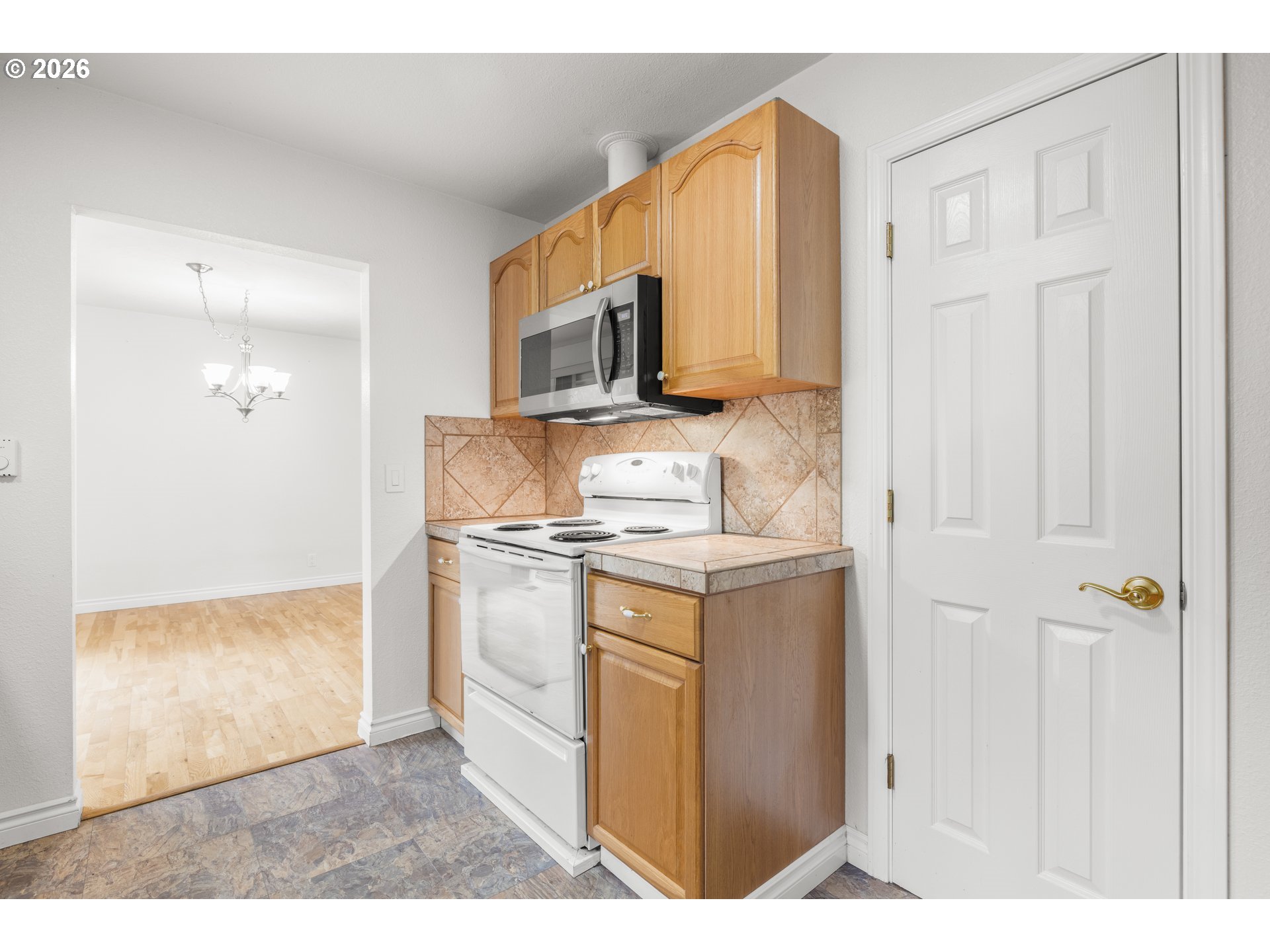 5720 Sollie Smith Road North Tillamook, OR 97141 - Photo 14 of 44 a kitchen with stainless steel appliances granite countertop a stove a sink and a refrigerator
