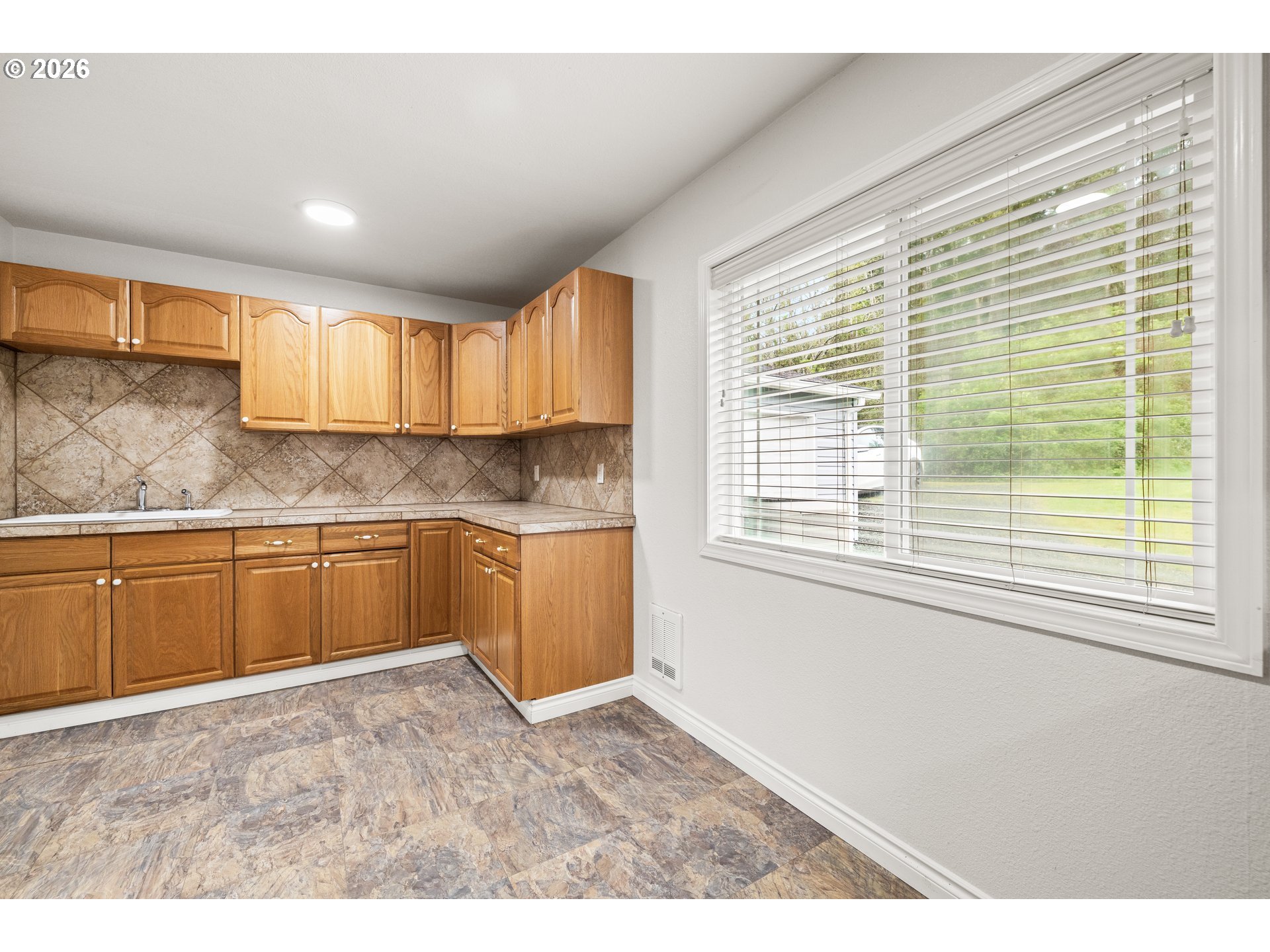 5720 Sollie Smith Road North Tillamook, OR 97141 - Photo 15 of 44 a kitchen with granite countertop a sink and a window
