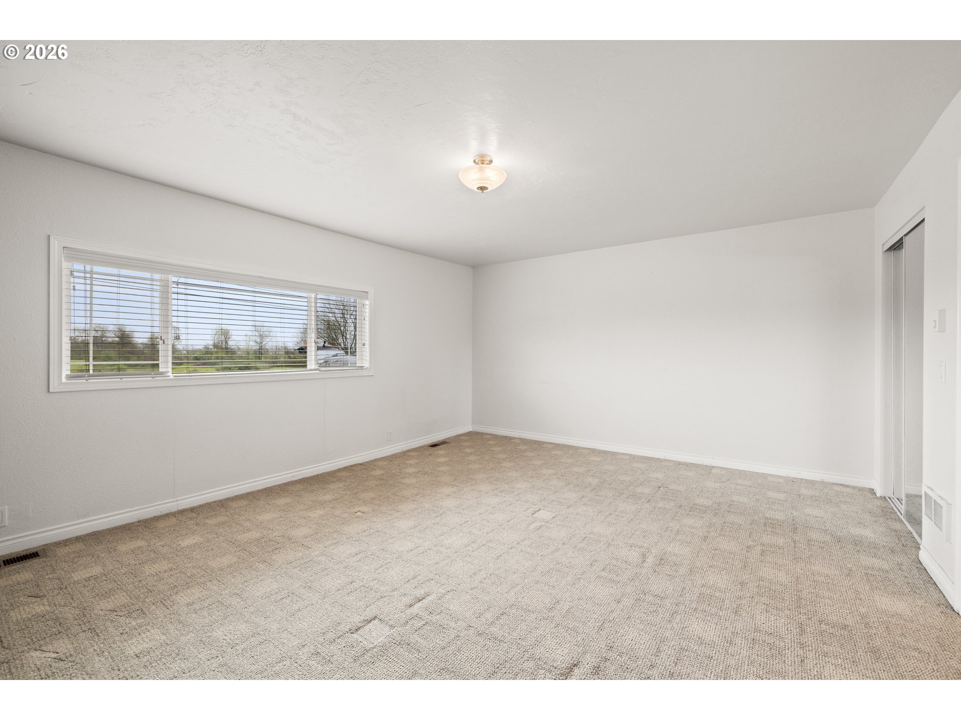 5720 Sollie Smith Road North Tillamook, OR 97141 - Photo 19 of 44 a view of an empty room with a window
