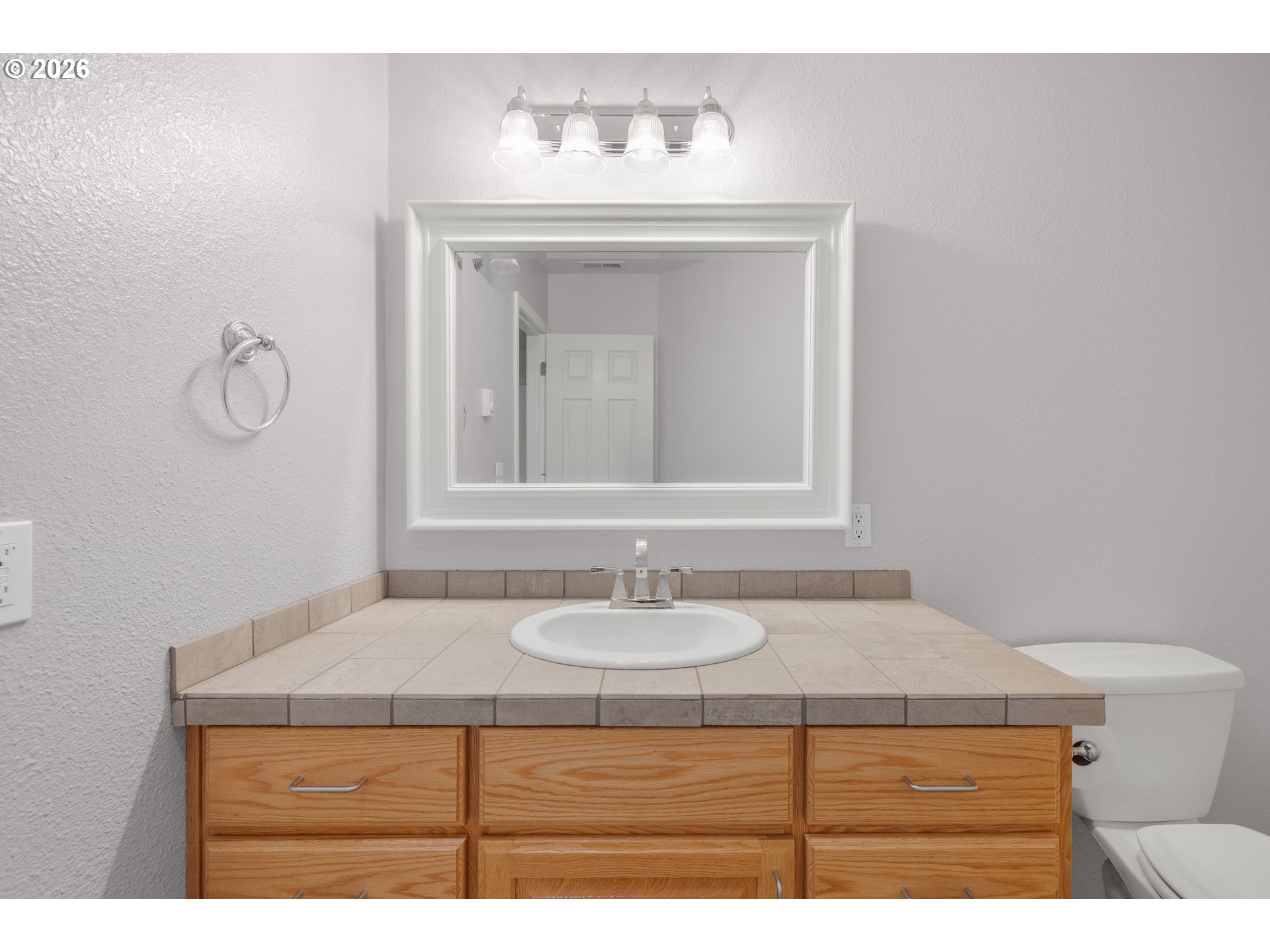 5720 Sollie Smith Road North Tillamook, OR 97141 - Photo 25 of 44 a bathroom with a sink and a mirror