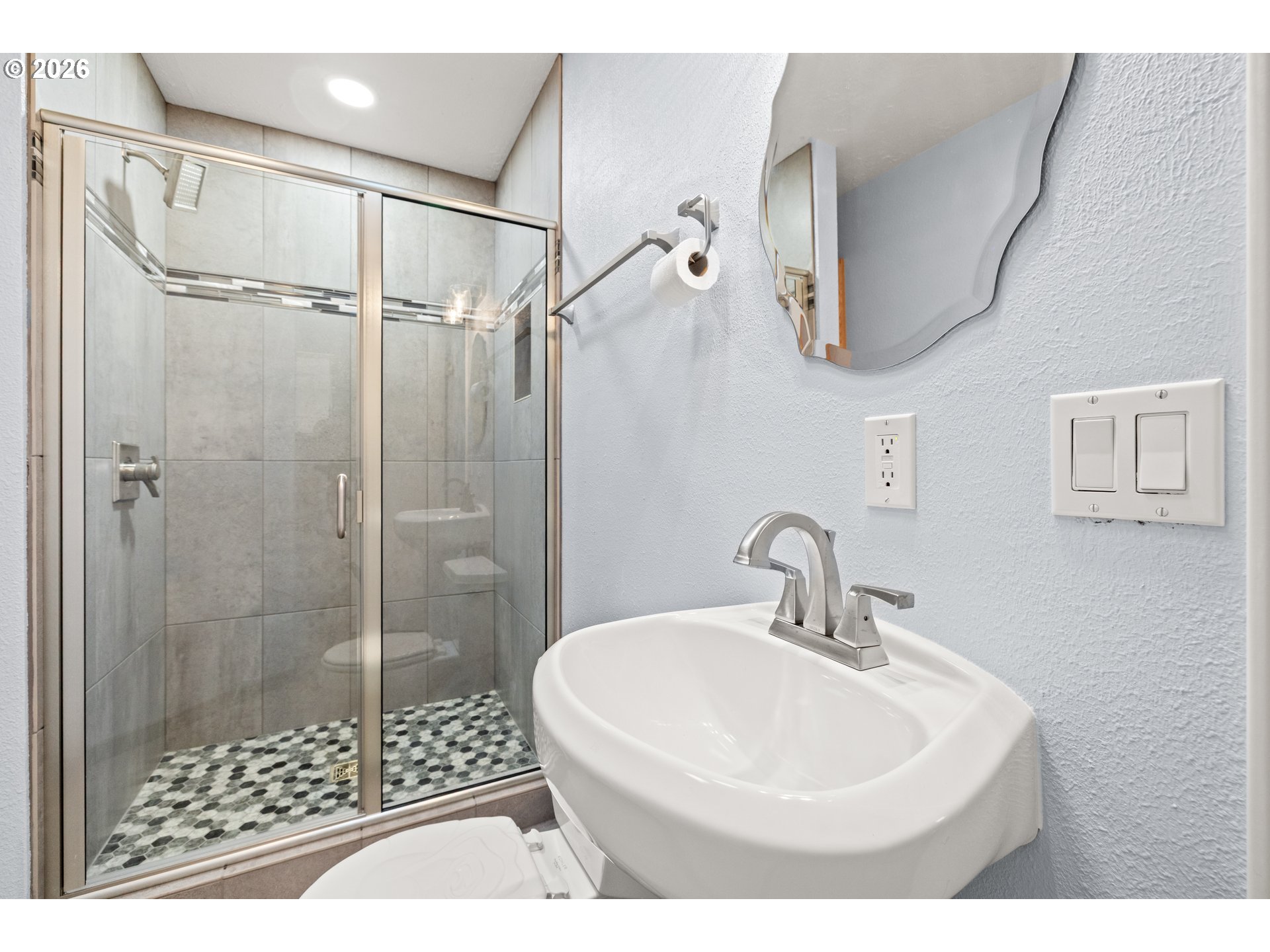 5720 Sollie Smith Road North Tillamook, OR 97141 - Photo 29 of 44 a bathroom with a sink a toilet and shower