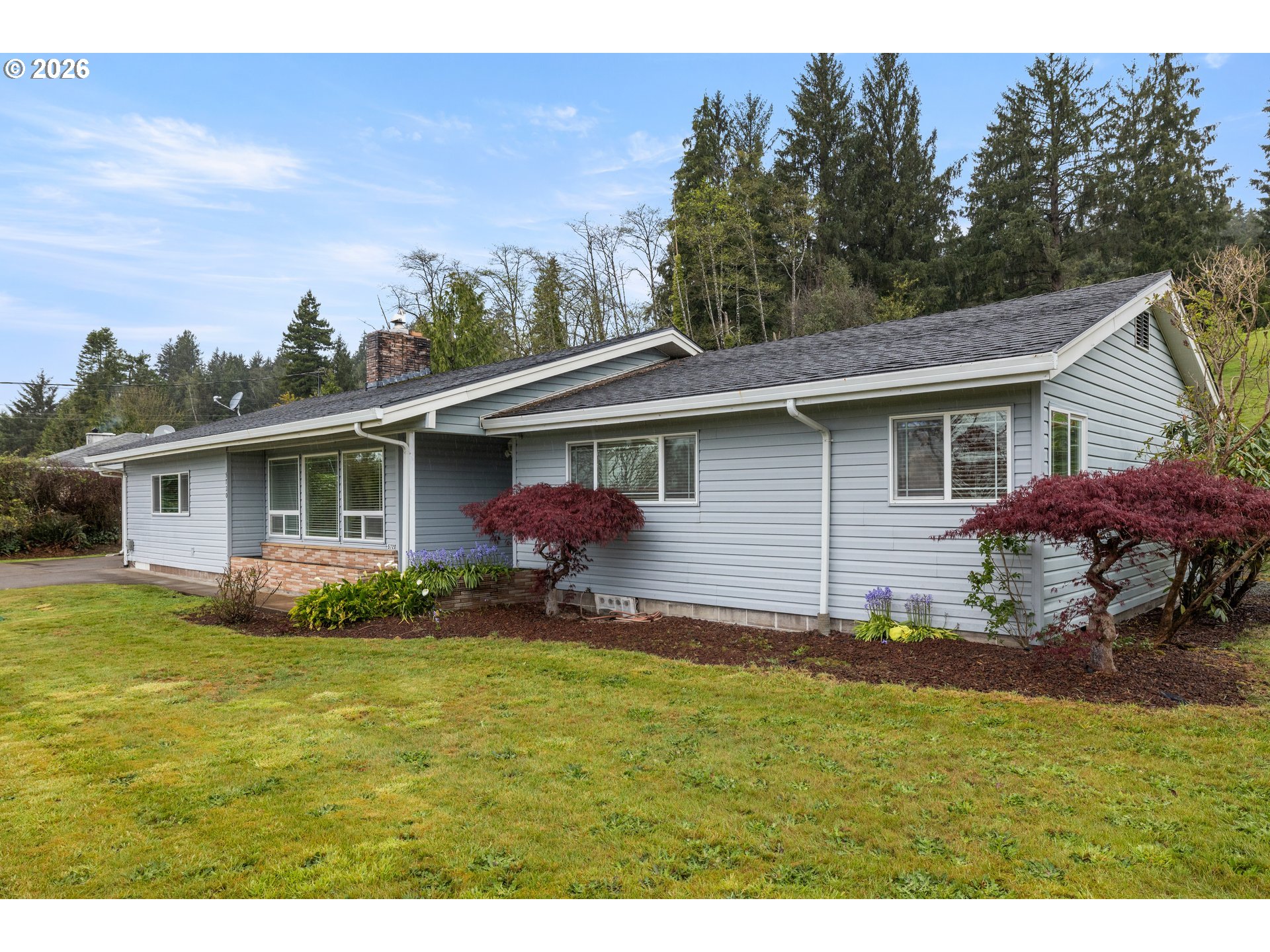 5720 Sollie Smith Road North Tillamook, OR 97141 - Photo 4 of 44 a backyard of a house with yard table and chairs