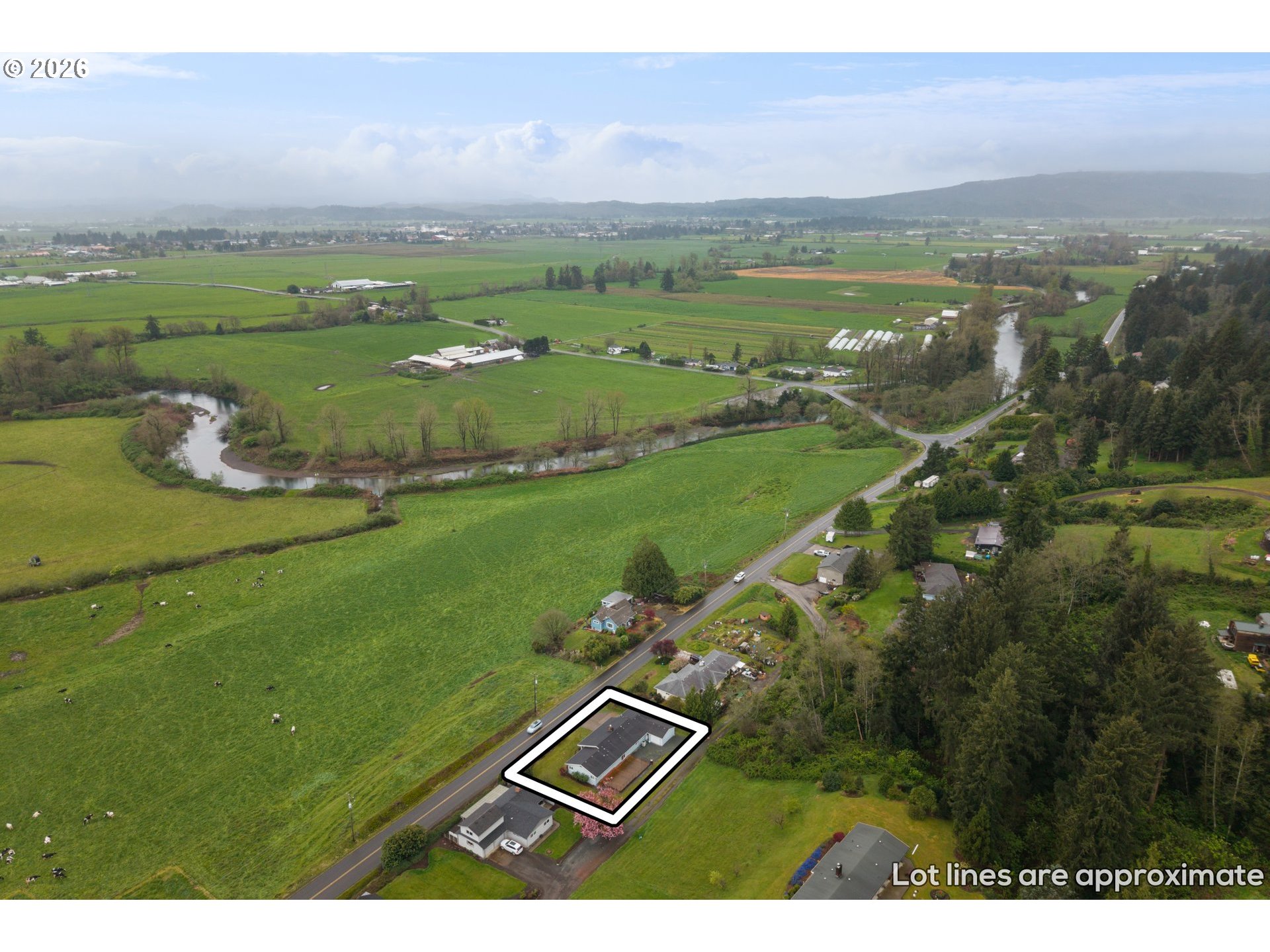 5720 Sollie Smith Road North Tillamook, OR 97141 - Photo 41 of 44 a view of a city with mountains in the background