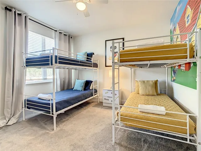 a white toilet sitting next to a bath tub