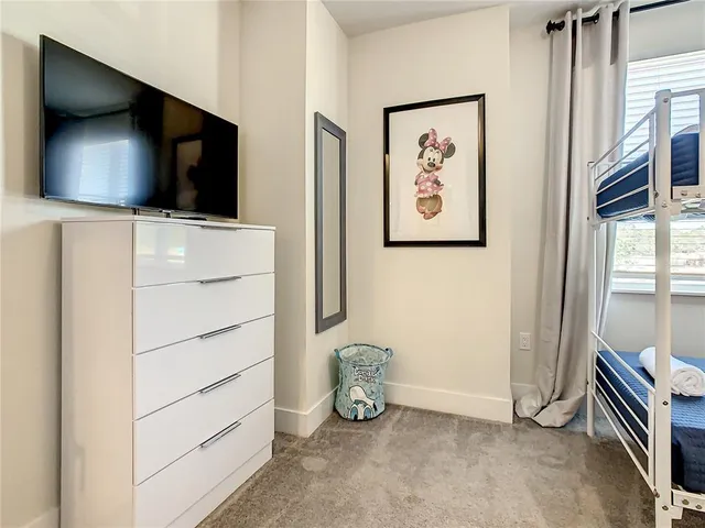 a kitchen with a sink a stove and a dining table