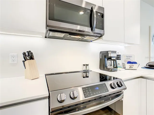 a bedroom with a bed and glass window