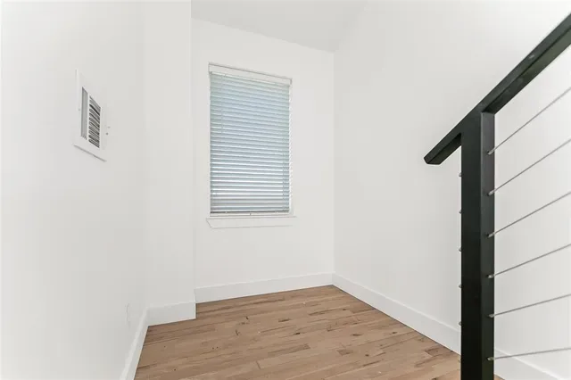 a view of a balcony with wooden floor