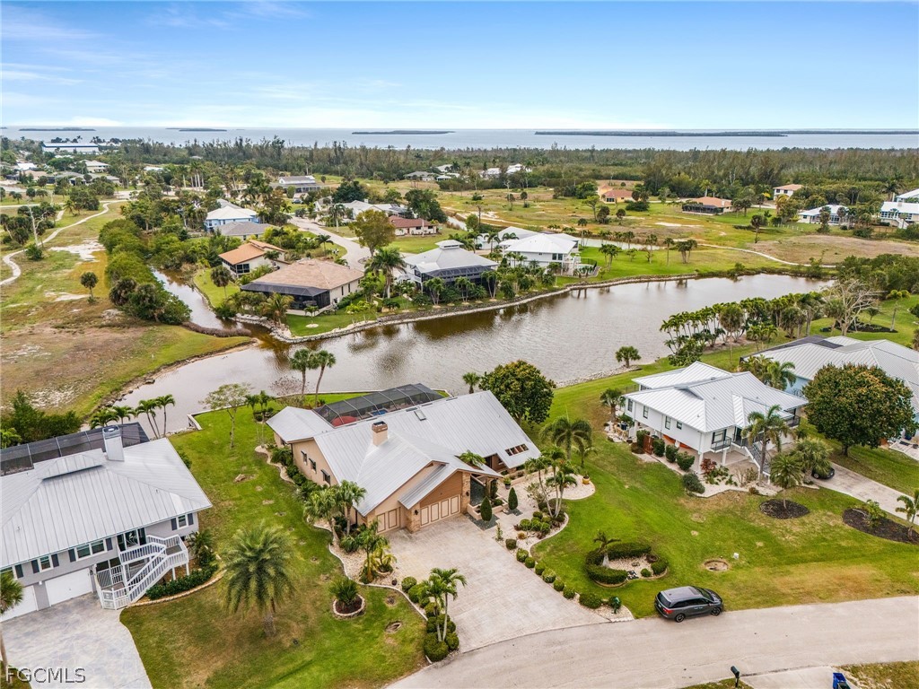 7747 Grande Pine Road Bokeelia, FL 33922 - Photo 41 of 45 an aerial view of residential houses with outdoor space