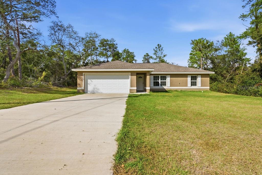 16592 Southwest 31st Circle Ocala, FL 34473 - Photo 24 of 27 front view of a house with a yard