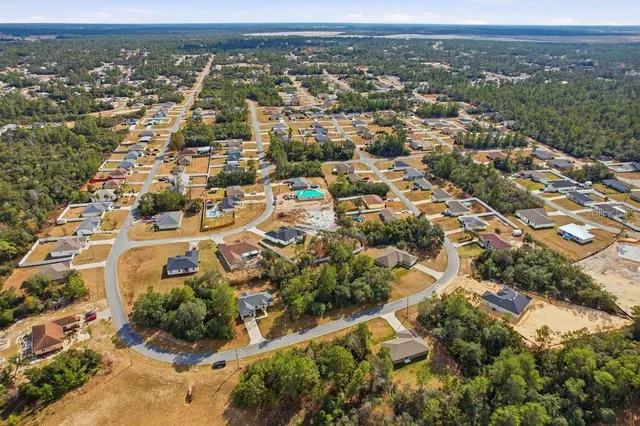 an aerial view of residential building with parking space
