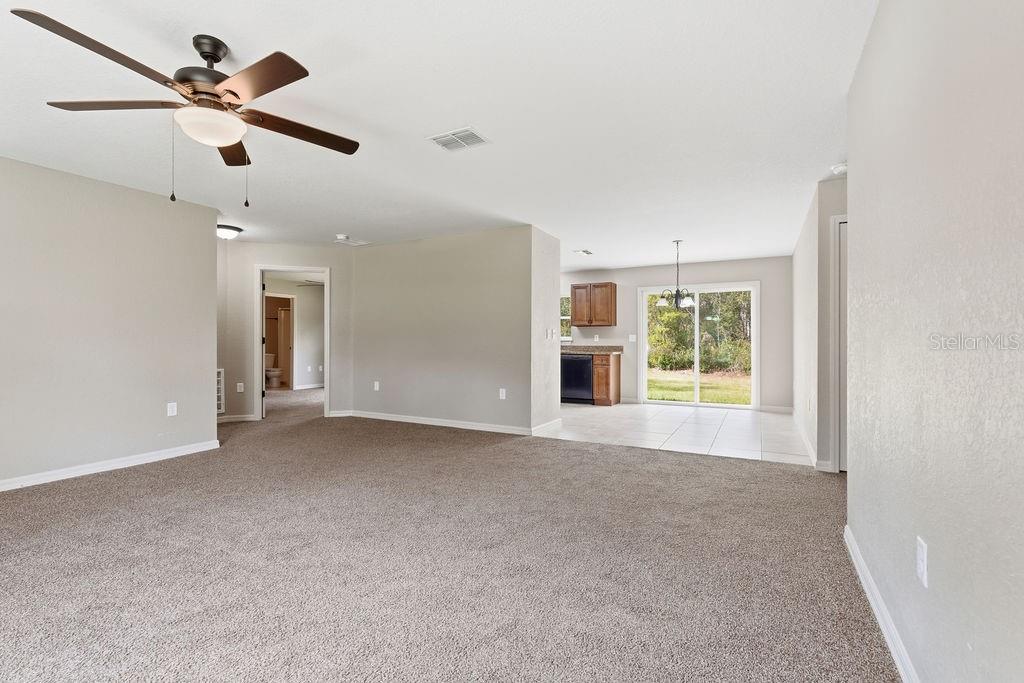 16592 Southwest 31st Circle Ocala, FL 34473 - Photo 8 of 27 a view of a livingroom with a ceiling fan and window