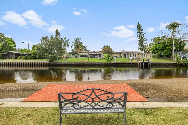a view of a lake with a garden