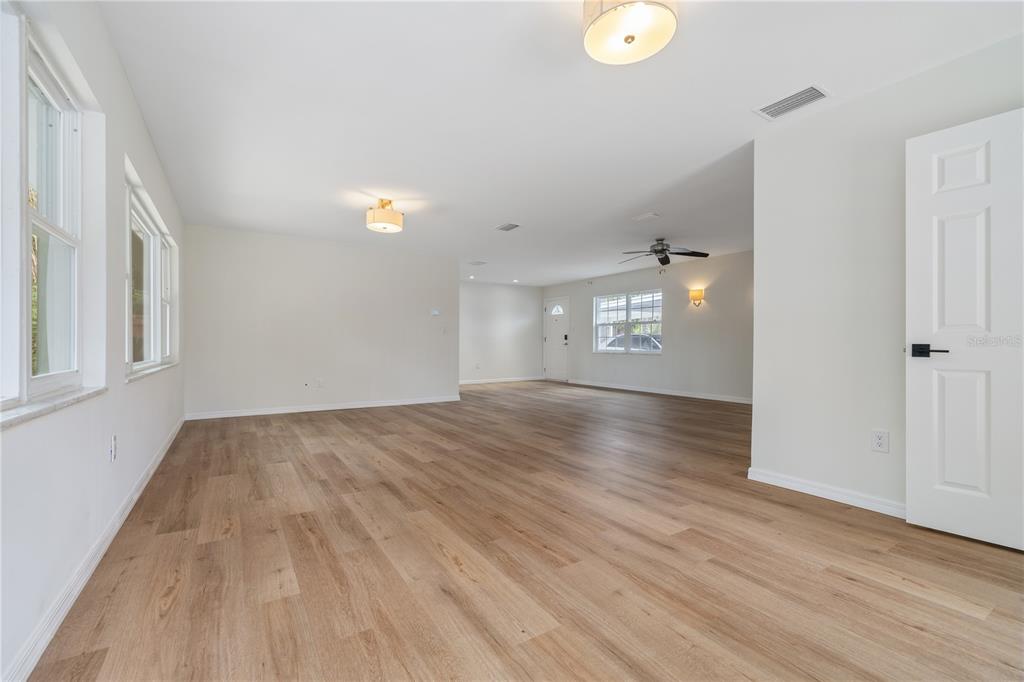 8916 Memorial Highway Tampa, FL 33615 - Photo 5 of 26 a view of livingroom with hardwood floor and window