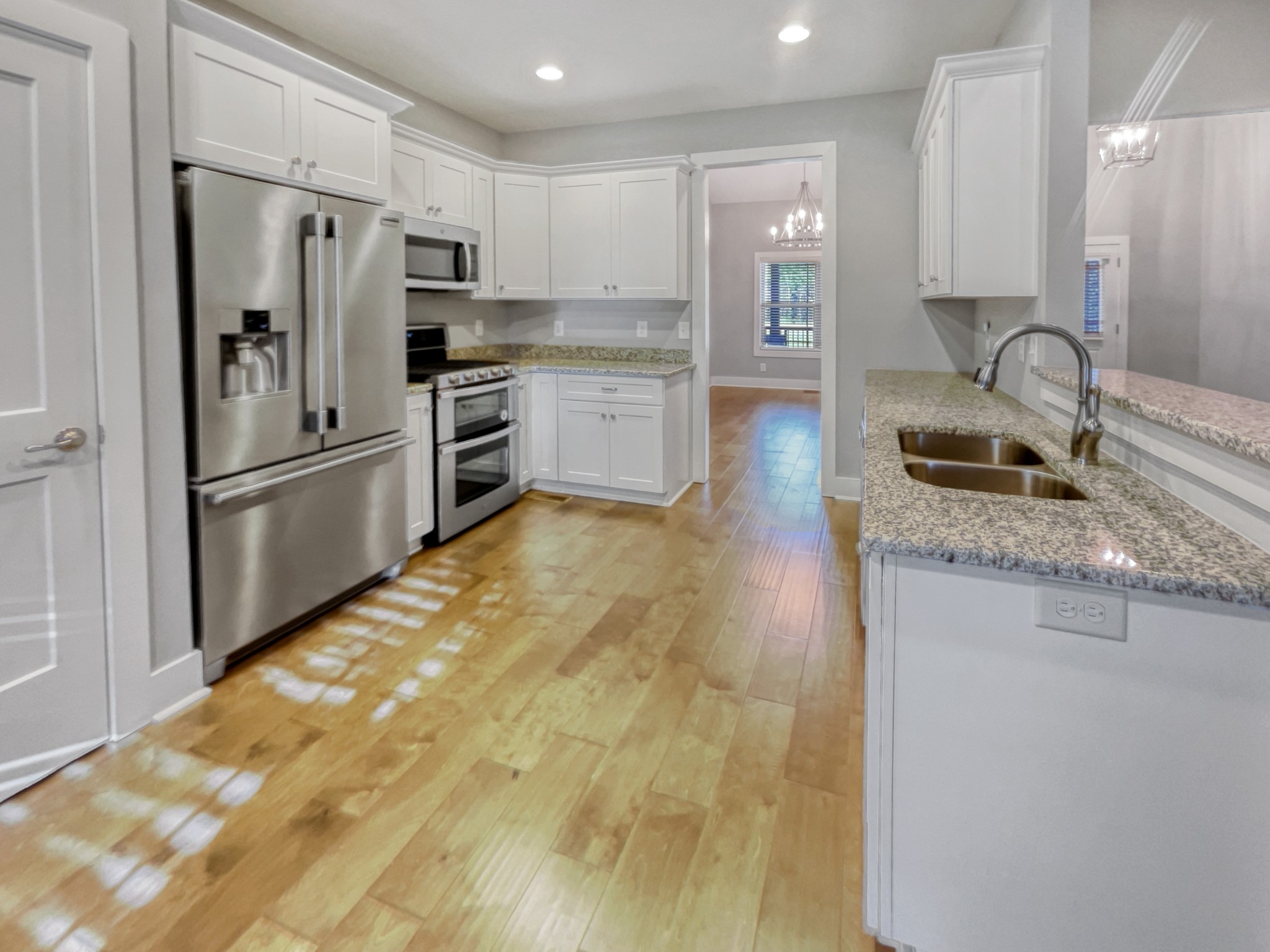 6650 Murfreesboro Road Lebanon, TN 37090 - Photo 11 of 27 a kitchen with granite countertop a refrigerator and a sink