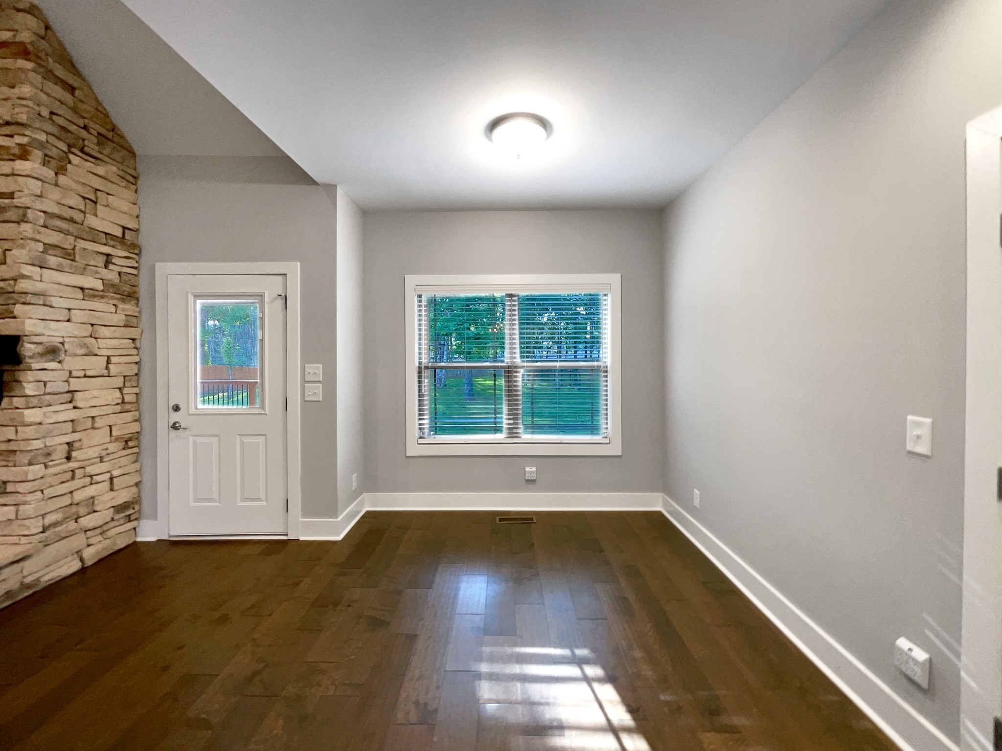 6650 Murfreesboro Road Lebanon, TN 37090 - Photo 13 of 27 an empty room with wooden floor and windows