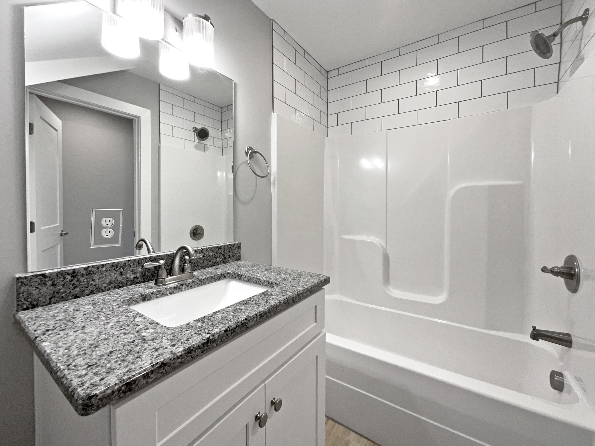 6650 Murfreesboro Road Lebanon, TN 37090 - Photo 25 of 27 a bathroom with a granite countertop sink and a mirror