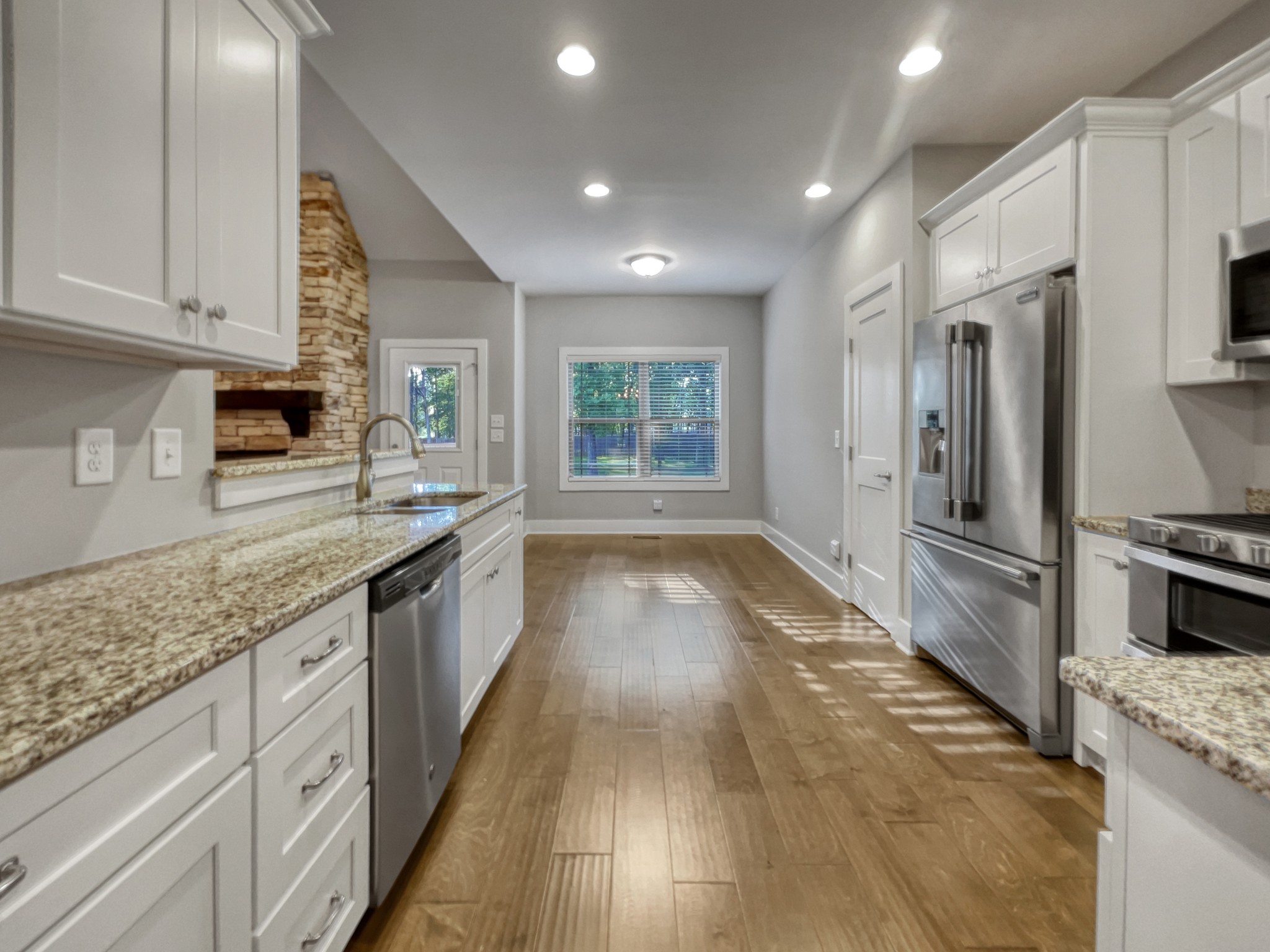 6650 Murfreesboro Road Lebanon, TN 37090 - Photo 10 of 27 a large kitchen with stainless steel appliances granite countertop a lot of counter space and wooden floor