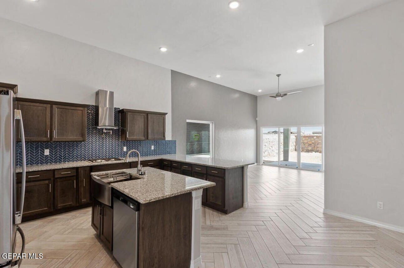 6042 Fall Ridge Sunland Park, NM 88008 - Photo 4 of 11 a kitchen with a sink stove and refrigerator