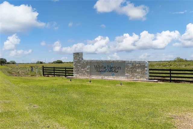 a view of a swimming pool with a yard