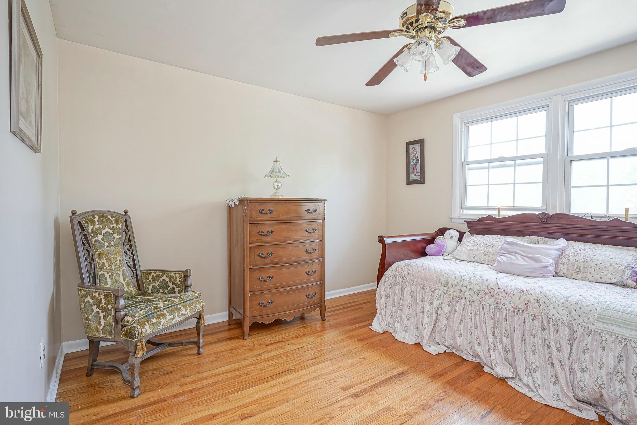 118 Golfview Drive Sewell, NJ 08080 - Photo 24 of 39 a bedroom with a bed and wooden floor